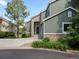 Charming two-story home with stone accents, attached garage, and landscaped front yard at 7400 W Grant Ranch Blvd # 19, Littleton, CO 80123