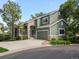 Charming two-story home with stone accents, attached garage, and a well-manicured front yard at 7400 W Grant Ranch Blvd # 19, Littleton, CO 80123