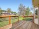 Wooden back deck overlooking fenced-in backyard with wooden and metal railing at 3873 W 98Th Ave, Westminster, CO 80031
