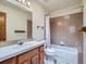 Bathroom with vanity, sink, mirror and tiled shower and bathtub at 3873 W 98Th Ave, Westminster, CO 80031