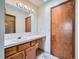 Bathroom featuring a well-lit vanity, mirror and cabinet space at 3873 W 98Th Ave, Westminster, CO 80031