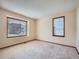 Bright bedroom featuring neutral carpet, large windows, and ample natural light at 3873 W 98Th Ave, Westminster, CO 80031