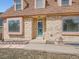 Close-up of a brick home's front entrance, highlighting the detailed brickwork and inviting doorway at 3873 W 98Th Ave, Westminster, CO 80031