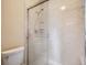 Modern glass shower with marbled tile and adjustable shower head at 3873 W 98Th Ave, Westminster, CO 80031