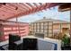 Relaxing outdoor patio area with pergola, seating, and stylish outdoor decor at 8638 Gold Peak Dr # D, Highlands Ranch, CO 80130