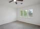 Comfortable bedroom with a large window bringing in natural light at 8638 Gold Peak Dr # D, Highlands Ranch, CO 80130