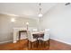 Dining area featuring hardwood floors, neutral paint, and modern lighting at 8638 Gold Peak Dr # D, Highlands Ranch, CO 80130