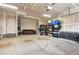 Spacious garage for parking and storage, featuring a couch and some shelving at 8638 Gold Peak Dr # D, Highlands Ranch, CO 80130