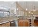 Modern kitchen showcasing stainless steel appliances, granite counters, and wine rack at 8638 Gold Peak Dr # D, Highlands Ranch, CO 80130