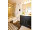 Well-lit bathroom featuring a glass-enclosed shower, a dark vanity, and modern fixtures for a spa-like experience at 1625 Larimer St # 2708, Denver, CO 80202