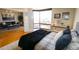 Spacious bedroom boasts a large window with expansive city views and adjoins a cozy living area at 1625 Larimer St # 2708, Denver, CO 80202
