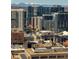 Stunning aerial view of Denver featuring a mix of modern buildings, historic landmarks, and mountain backdrop at 1625 Larimer St # 2708, Denver, CO 80202