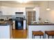 Bright kitchen features white cabinets, stainless steel appliances, and a breakfast bar with seating at 1625 Larimer St # 2708, Denver, CO 80202