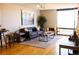 Inviting living room with modern decor, a comfortable sofa, and a large window offering natural light at 1625 Larimer St # 2708, Denver, CO 80202