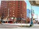A street view shows the building's exterior with a brick facade and modern architectural design at 1625 Larimer St # 2708, Denver, CO 80202