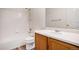 Bright bathroom featuring a combined tub and shower and vanity with a white top at 19172 E Arkansas Dr # 106, Aurora, CO 80017