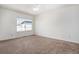 Bright bedroom features large window, ceiling fan and plush carpeting to create a comfortable retreat at 19172 E Arkansas Dr # 106, Aurora, CO 80017