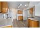 Spacious kitchen features light wood cabinetry, modern flooring, and a bright, functional layout at 19172 E Arkansas Dr # 106, Aurora, CO 80017