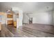 Open-concept living area featuring modern flooring, stairs to the upper level, and access to the kitchen at 19172 E Arkansas Dr # 106, Aurora, CO 80017