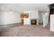 Inviting living room showcases a fireplace and seamless transition to the kitchen, creating a cozy and social atmosphere at 19172 E Arkansas Dr # 106, Aurora, CO 80017