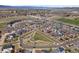 Overhead view of a well-planned community with houses, parks, and streets, showing neighborhood layout at 4401 Hydrangea Way, Castle Rock, CO 80109