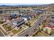 An aerial view shows a residential neighborhood featuring well-maintained homes and landscaping at 4401 Hydrangea Way, Castle Rock, CO 80109