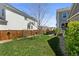 Well-maintained backyard with green lawn, landscaping, privacy fence, and shed perfect for relaxation at 4401 Hydrangea Way, Castle Rock, CO 80109