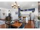 Dining room and kitchen area, featuring hardwood floors and stainless steel appliances at 4401 Hydrangea Way, Castle Rock, CO 80109