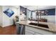 Granite countertops and stainless steel appliances shine in this well-lit kitchen with backyard patio access at 4401 Hydrangea Way, Castle Rock, CO 80109