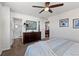 Bright main bedroom with carpet, ceiling fan, and ensuite bath at 4401 Hydrangea Way, Castle Rock, CO 80109