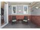 Outdoor patio with brick accents, seating for two, and butterfly wall art for a cozy spot at 4401 Hydrangea Way, Castle Rock, CO 80109
