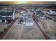 Beautiful aerial view of the property showcasing the backyard, neighborhood, and mountain views at 785 Delechant Dr, Erie, CO 80516