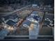 Aerial view of home and property with mature trees and privacy fence at 785 Delechant Dr, Erie, CO 80516