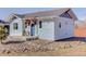 Charming home featuring a covered porch and a well-maintained yard, offering delightful curb appeal at 785 Delechant Dr, Erie, CO 80516