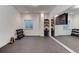 Well-equipped home gym with ample space, mirrors, and shelving for organized storage and effective workouts at 785 Delechant Dr, Erie, CO 80516