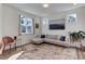 Cozy living room with a modern sofa, artistic accents, and ample natural light creating a relaxing atmosphere at 785 Delechant Dr, Erie, CO 80516