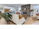 Stylish living room with a modern fireplace, hardwood floors, and access to the outdoor patio at 785 Delechant Dr, Erie, CO 80516