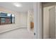 Bright bedroom with large window and ensuite bathroom entrance at 1878 W 32Nd Ave, Denver, CO 80211
