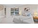 Bright bedroom featuring large windows, a cozy chair, and modern decor at 1878 W 32Nd Ave, Denver, CO 80211