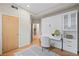 Murphy bed in a guest room with built-in shelving, hardwood floors, and a stylish rug at 1878 W 32Nd Ave, Denver, CO 80211