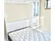 A contemporary bedroom features a pristine white bed with an attached built-in storage cabinet at 1878 W 32Nd Ave, Denver, CO 80211