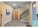 Modern entryway features tile flooring, staircase with sleek railings, and ample natural light at 1878 W 32Nd Ave, Denver, CO 80211
