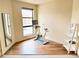 Bright exercise room with natural light, modern floors and an at-home stationary bike at 1878 W 32Nd Ave, Denver, CO 80211