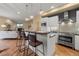 Modern kitchen featuring stainless steel appliances, ample counter space, and stylish bar seating at 1878 W 32Nd Ave, Denver, CO 80211