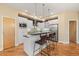 Stylish kitchen features a center island with seating, sleek countertops, and modern appliances at 1878 W 32Nd Ave, Denver, CO 80211