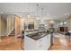 Bright and modern kitchen featuring an island with bar seating, perfect for entertaining guests at 1878 W 32Nd Ave, Denver, CO 80211