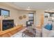 Cozy living room featuring hardwood floors, a fireplace, and stylish decor, creating a welcoming atmosphere at 1878 W 32Nd Ave, Denver, CO 80211