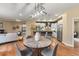 Open-concept living area with modern lighting, a dining table, and a stylish kitchen at 1878 W 32Nd Ave, Denver, CO 80211