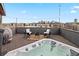 Relaxing rooftop deck featuring a hot tub, comfortable seating, and city views at 1878 W 32Nd Ave, Denver, CO 80211