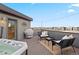 Inviting rooftop deck with hot tub, comfortable seating, and panoramic city views for entertaining at 1878 W 32Nd Ave, Denver, CO 80211